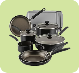 Dark grey 9 piece cookware set on a green background 