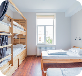 A clean and fully furnished dorm room.